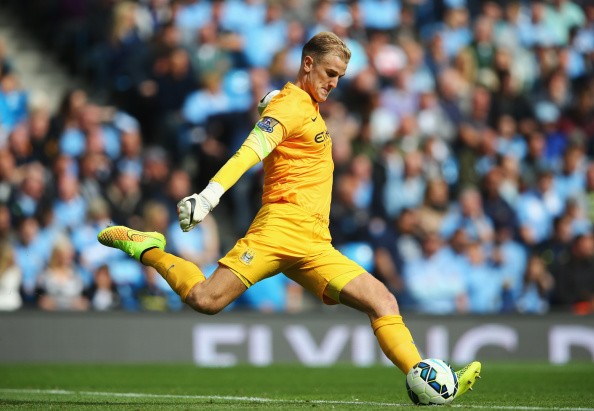 Joe Hart of Manchester City kicks down field during the Barclays Premier League