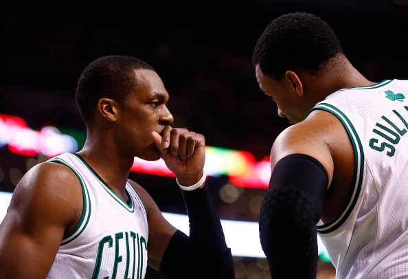 Rajon Rondo #9 talks with teammate Jared Sullinger #7 of the Boston Celtics
