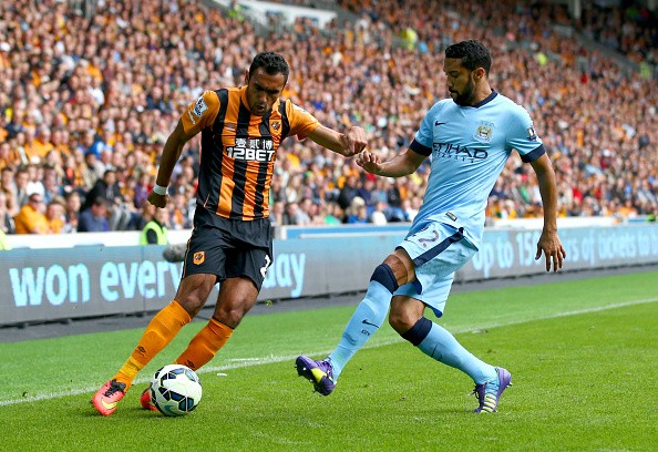 Gael Clichy of Manchester City challenges Ahmed Elmohamady of Hull City 