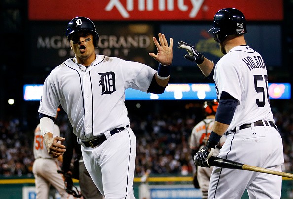 Victor Martinez #41 is congratulated by Bryan Holaday #50 of the Detroit Tigers