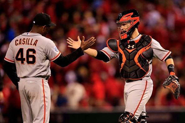Santiago Casilla #46 and Buster Posey #28 