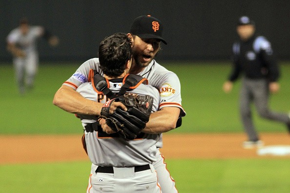 Buster Posey #28 and Madison Bumgarner #40 of the San Francisco Giants