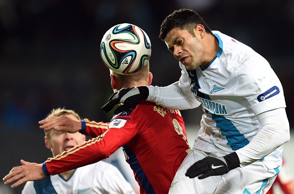 Pontus Wernbloom of PFC CSKA Moscow challenged by Hulk (R) of FC Zenit St. Petersburg 