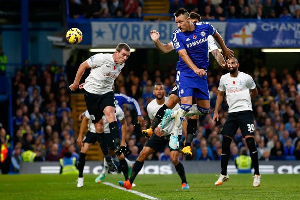 John Terry of Chelsea heads at goal during the Barclays Premier League
