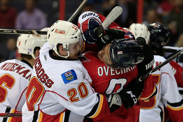 Curtis Glencross #20 of the Calgary Flames and Alex Ovechkin #8 of the Washington Capitals