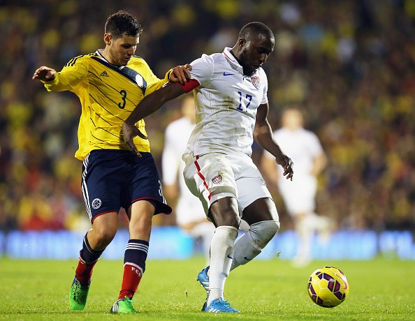 Jozy Altidore of the USA holds off Pedro Franco of Colombia