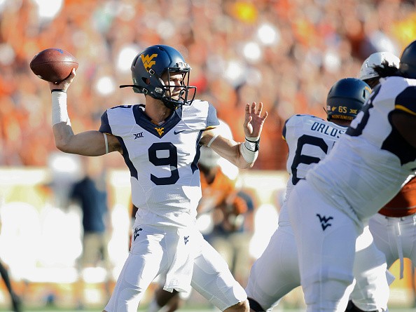 Quarterback Clint Trickett #9 of the West Virginia Mountaineers
