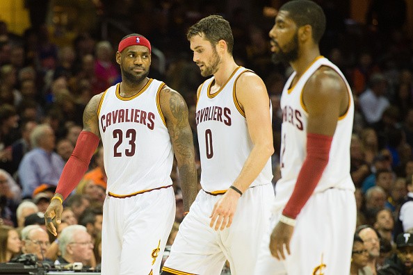 LeBron James #23 Kevin Love #0 and Kyrie Irving #2 of the Cleveland Cavaliers