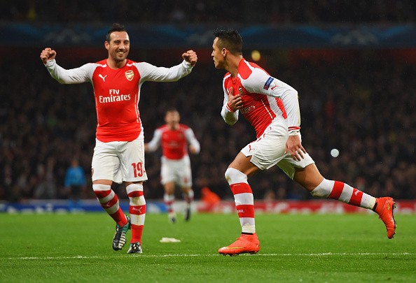 Alexis Sanchez of Arsenal (R) celebrates with Santi Cazorla