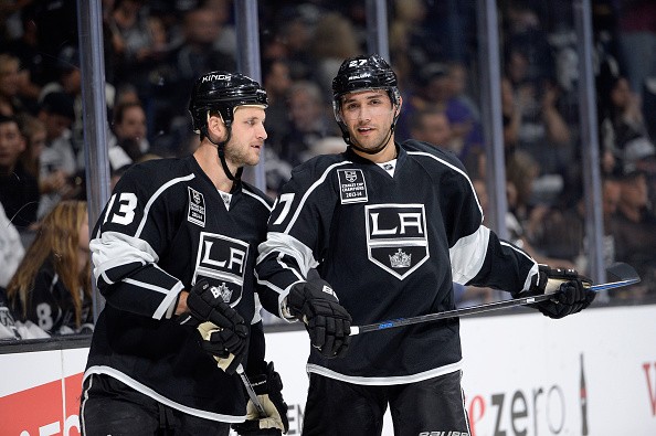 Kyle Clifford #13 of the Los Angeles Kings and Alec Martinez #27