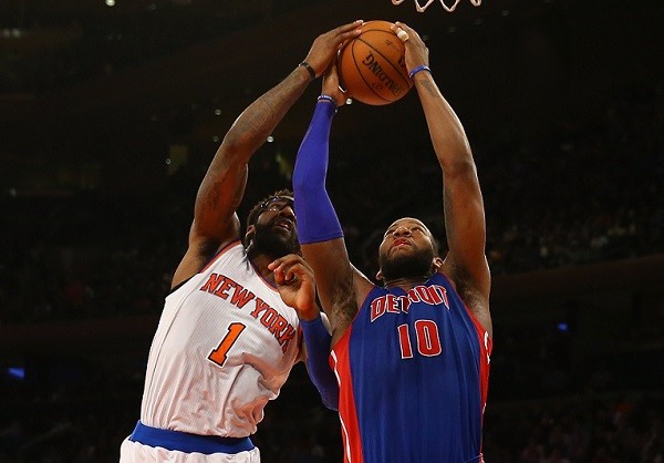 Greg Monroe #10 of the Detroit Pistons and Amar'e Stoudemire
