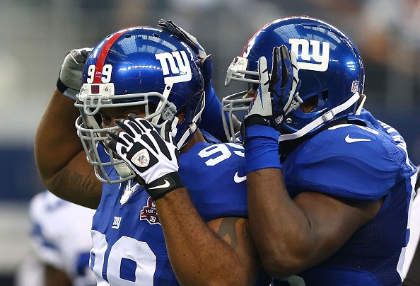 Cullen Jenkins #99 of the New York Giants and Jason Pierre-Paul #90 of the New York Giants