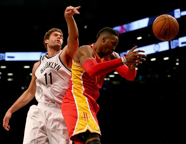 Dwight Howard #12 of the Houston Rockets and Brook Lopez #11 of the Brooklyn Nets 