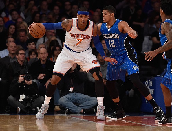 Carmelo Anthony #7 of the New York Knicks dribbles against Tobias Harris #12 of the Orlando Magic