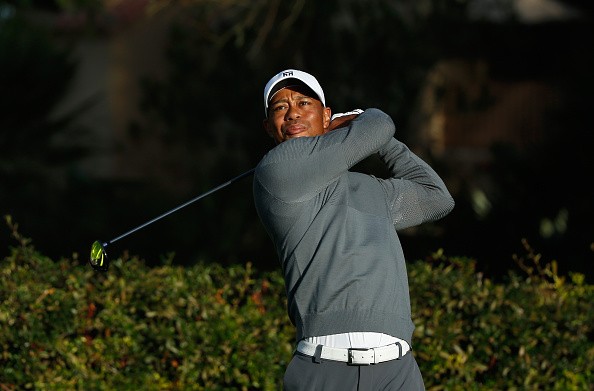Tiger Woods hits a shot during the pro-am