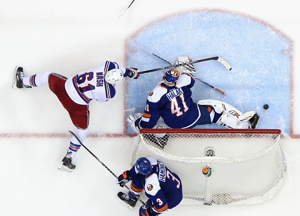 Jaroslav Halak #41 of the New York Islanders makes the toe save on Rick Nash #6