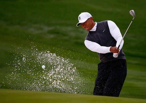 Tiger Woods plays a shot on the 17th hole