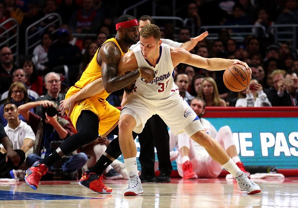 Blake Griffin #32 of the Los Angeles Clippers tries to drive against LeBron James