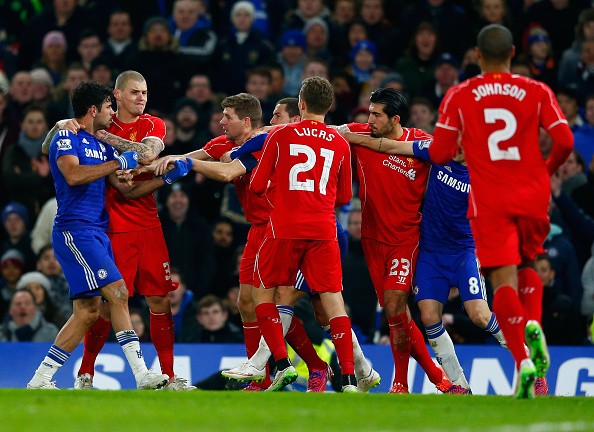 Diego Costa of Chelsea clashes with Martin Skrtel, Steven Gerrard and Emre Can 