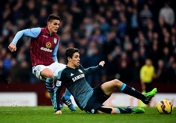 Oscar of Chelsea battles for the ball with Ashley Westwood 