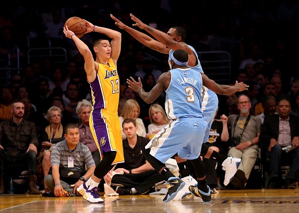 Jeremy Lin #17 of the Los Angeles Lakers looks to pass over Ty Lawson #3 