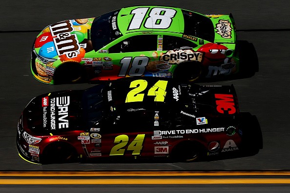 Kyle Busch, driver of the #18 M&M's Crispy Toyota, and Jeff Gordon