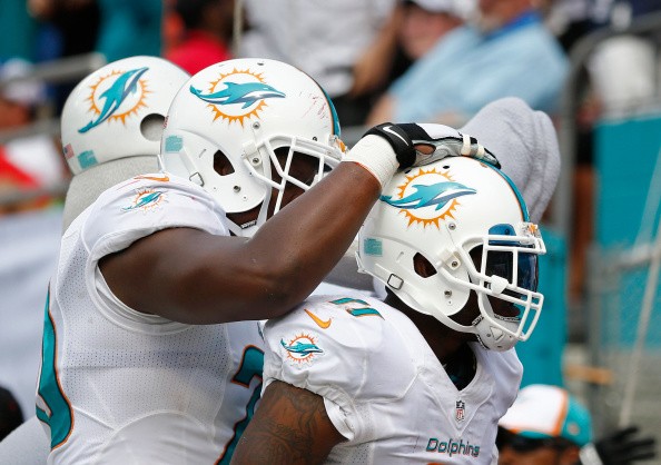 Mike Wallace #11, right, of the Miami Dolphins 
