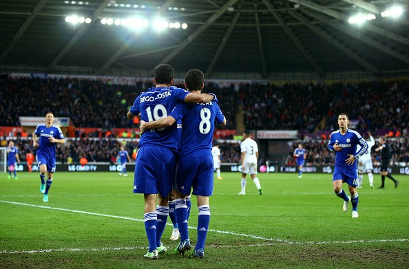 Oscar of Chelsea celebrates with Diego Costa