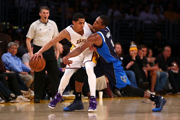 Jordan Clarkson #6 of the Los Angeles Lakers protects the ball from Rajon Rondo 