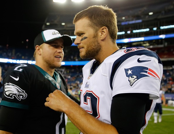 Tom Brady #12 of the New England Patriots talks with Matt Barkley #2 of the Philadelphia Eagles