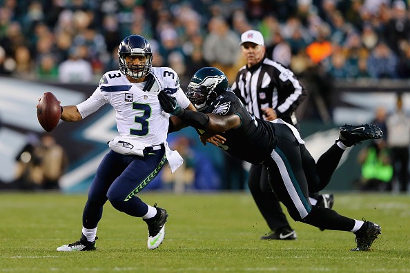 Vinny Curry #75 of the Philadelphia Eagles attempts to tackle quarterback Russell Wilson #3 of the Seattle Seahawks