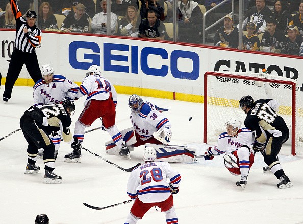 Patric Hornqvist #72 of the Pittsburgh Penguins scores in the third period against Henrik Lundqvist #30 