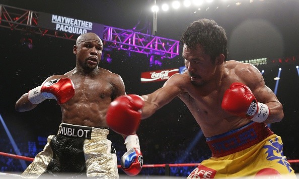 Floyd Mayweather Jr. exchange punches with Manny Pacquiao