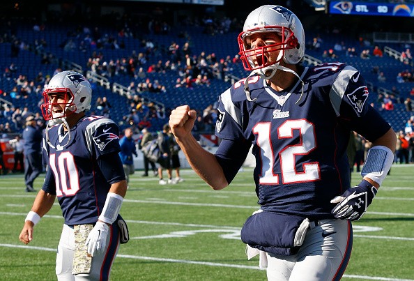 New England Patriots quarterbacks Tom Brady, right, and Jimmy Garoppolo
