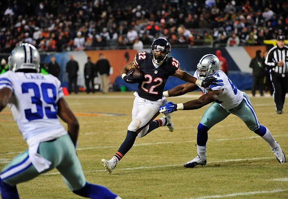 Matt Forte #22 of the Chicago Bears is pursued by Bruce Carter #54 of the Dallas Cowboys