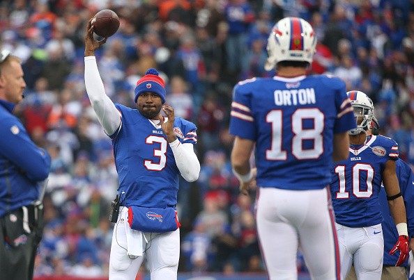 E.J. Manuel #3 of the Buffalo Bills stays loose as he tosses the ball with Kyle Orton #18