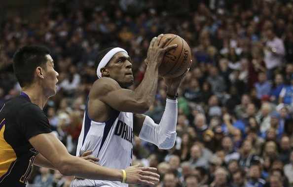 Rajon Rondo (R) of the Dallas Mavericks in action against the Los Angeles Lakers