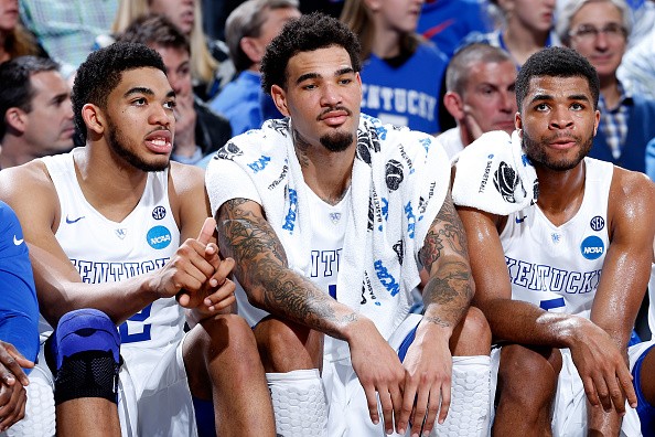 Karl-Anthony Towns #12, Willie Cauley-Stein #15, and Andrew Harrison #5 of the Kentucky Wildcats 