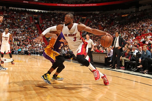 Dwyane Wade #3 of the Miami Heat drives to the basket against the Los Angeles Lakers