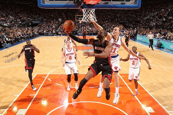 Dwyane Wade #3 of the Miami Heat goes to the basket against the New York Knicks 