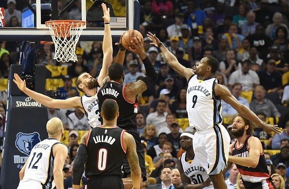 Marc Gasol #33 and Tony Allen #9 of the Memphis Grizzlies jump to block a shot by LaMarcus Aldridge #12 of the Portland Trailblazers