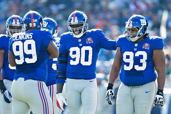 Cullen Jenkins #99, Johnathan Hankins #95, Mike Patterson #93 and Jason Pierre-Paul #90 of the New York Giants