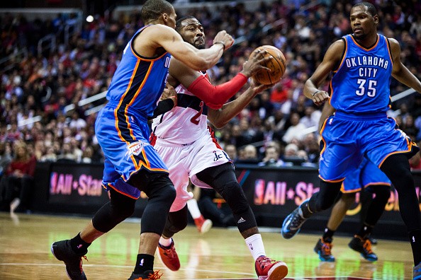 John Wall (2) of Washington Wizard in action against Russell Westbrook (0) and Kevin Durant (35) of Oklahoma City Thunder 