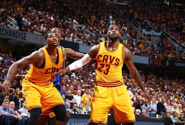 Tristan Thompson #13 of the Cleveland Cavaliers and LeBron James #23 of the Cleveland Cavaliers 
