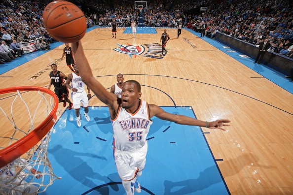 Kevin Durant #35 of the Oklahoma City Thunder dunks on a fast break against the Miami Heat