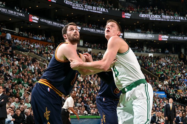 Kevin Love #0 of the Cleveland Cavaliers battles for position against Jonas Jerebko #8 of the Boston Celtics 