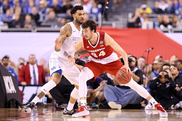 Frank Kaminsky #44 of the Wisconsin Badgers handles the ball against Willie Cauley-Stein #15 of the Kentucky Wildcats 