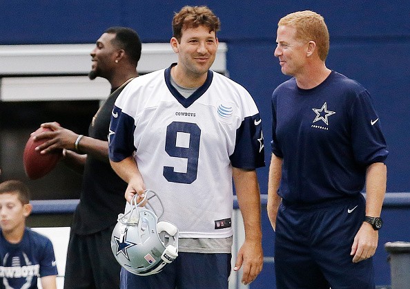 Dallas Cowboys quarterback Tony Romo (9) and head coach Jason Garrett, right, talk on the sidelines as wide receiver Dez Bryant