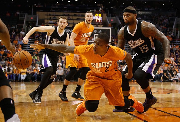 Eric Bledsoe #2 of the Phoenix Suns attempts to control a loose ball defended by DeMarcus Cousins #15 of the Sacramento Kings