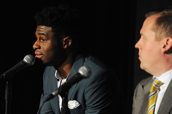 The seventh selection in the 2015 NBA Draft Emmanuel Mudiay #0 and General Manager Tim Connelly of the Denver Nuggets